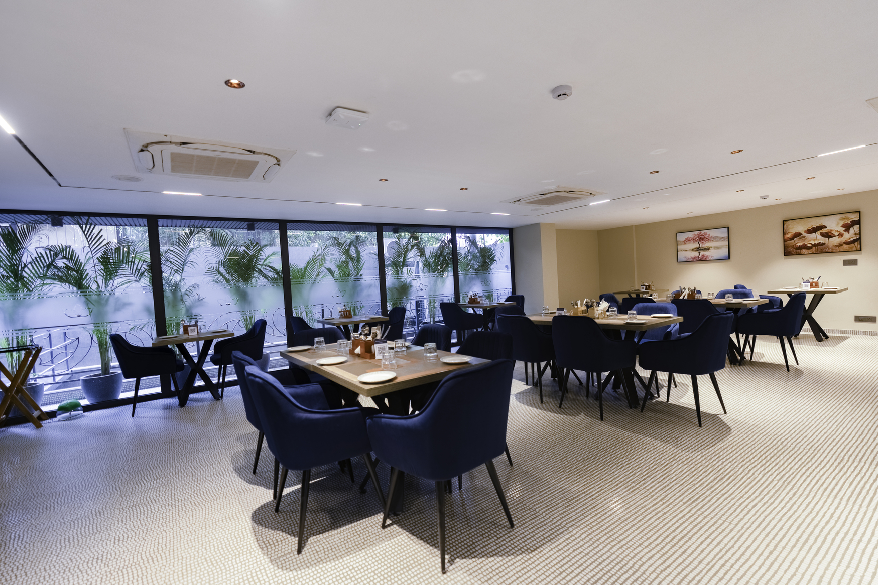 Elegant banquet hall with round tables and chandelier lighting
