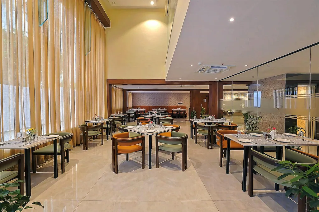 Elegant banquet hall with round tables and chandelier lighting